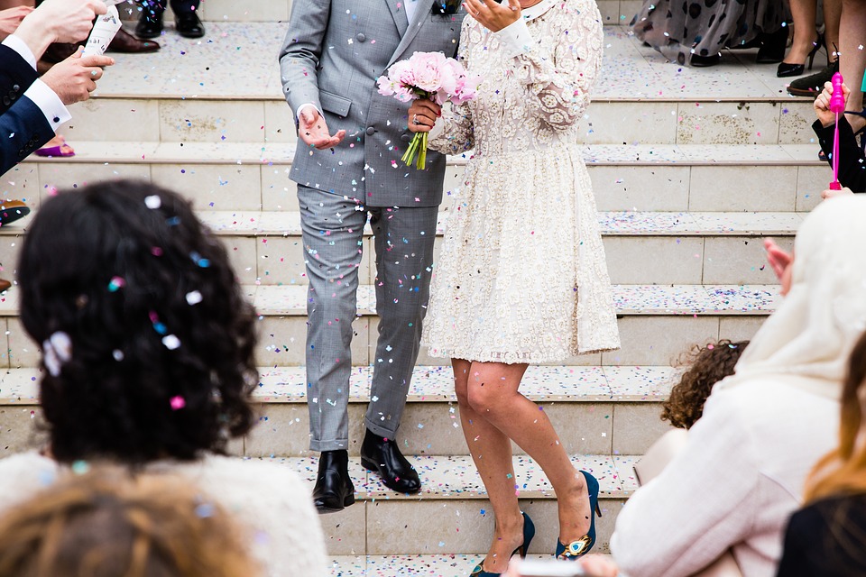 bridesmaid and best man walking down steps at a wedding