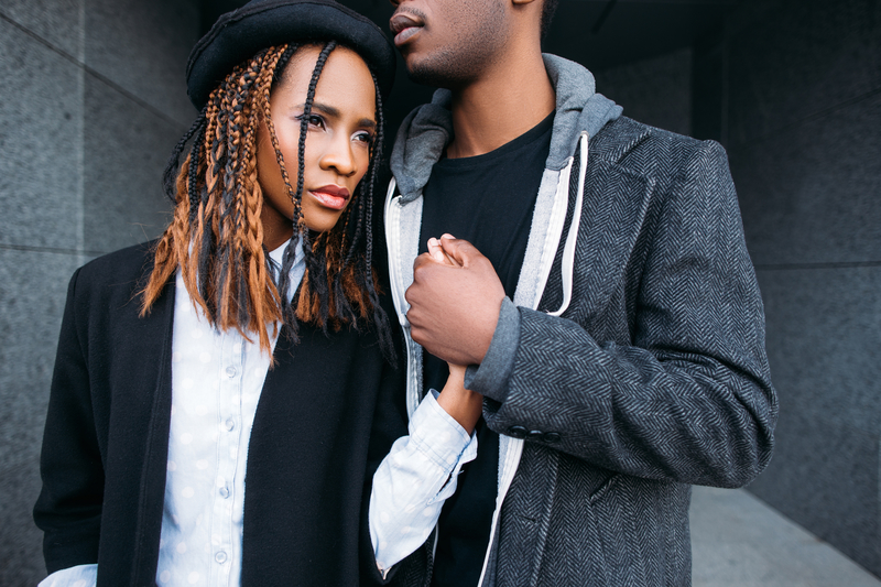 Strong relationship. African American couple. Young fashionable people, stylish man and woman, unrecognizable male, love concept